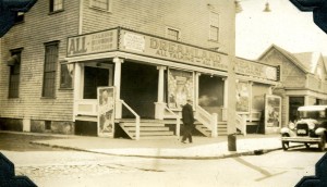 The Dreamland Theatre c. 1930, showing movie posters for the films Vengeance and Sky Hawk.